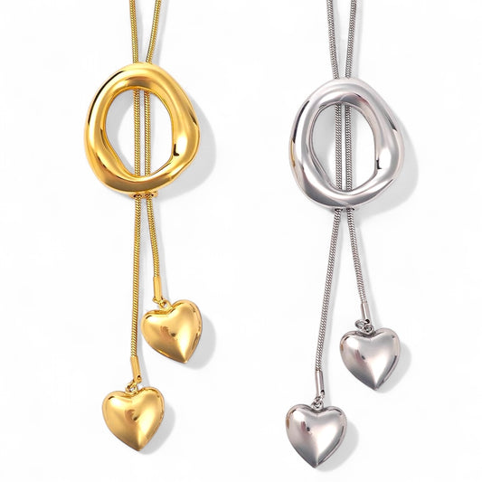 Ατσάλινο κολιέ με ρευστό οβάλ κρίκο και καρδιές – So Cute by Dimi