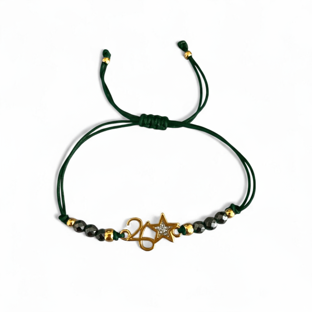 Χειροποίητο βραχιόλι γούρι 2026 με αιματίτη & αστεράκι glitter σε κορδόνι – So Cute by Dimi Wholesale