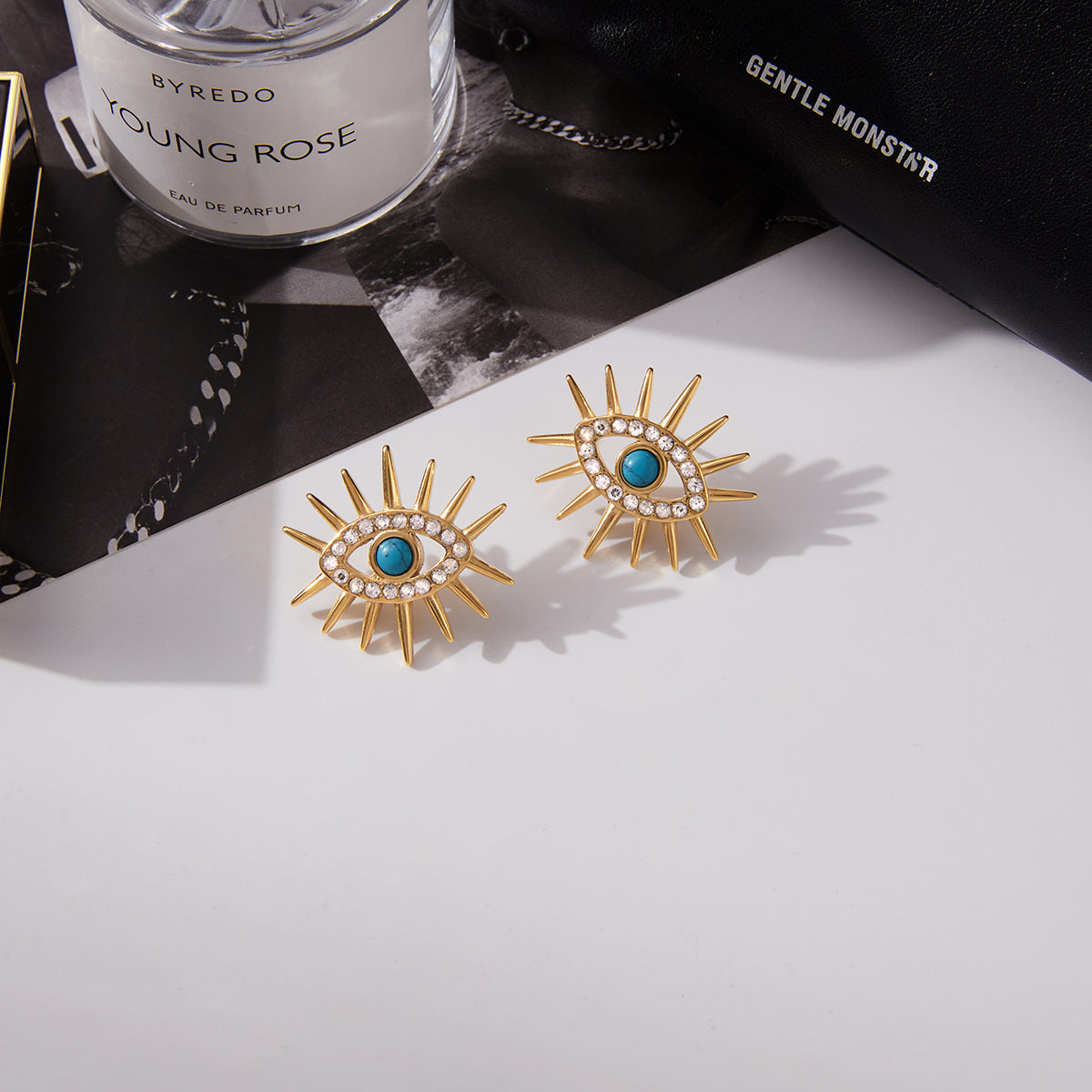 Σκουλαρίκια “Solar Eye” – Ατσάλινα με τιρκουάζ μάτι και ζιργκόν | So Cute by Dimi Wholesale