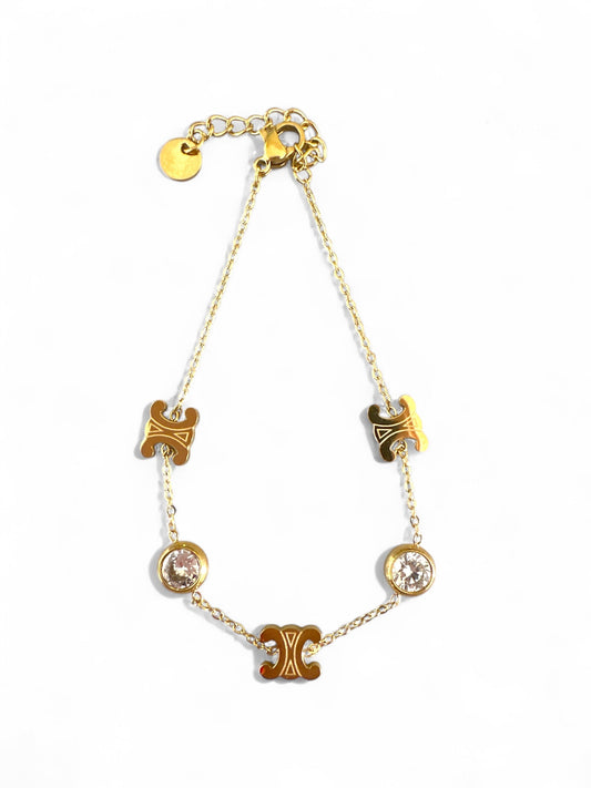 Ατσάλινο χρυσό βραχιόλι με λογότυπο “διπλό C” και δύο λευκά ζιργκόν σε λεπτή αλυσίδα