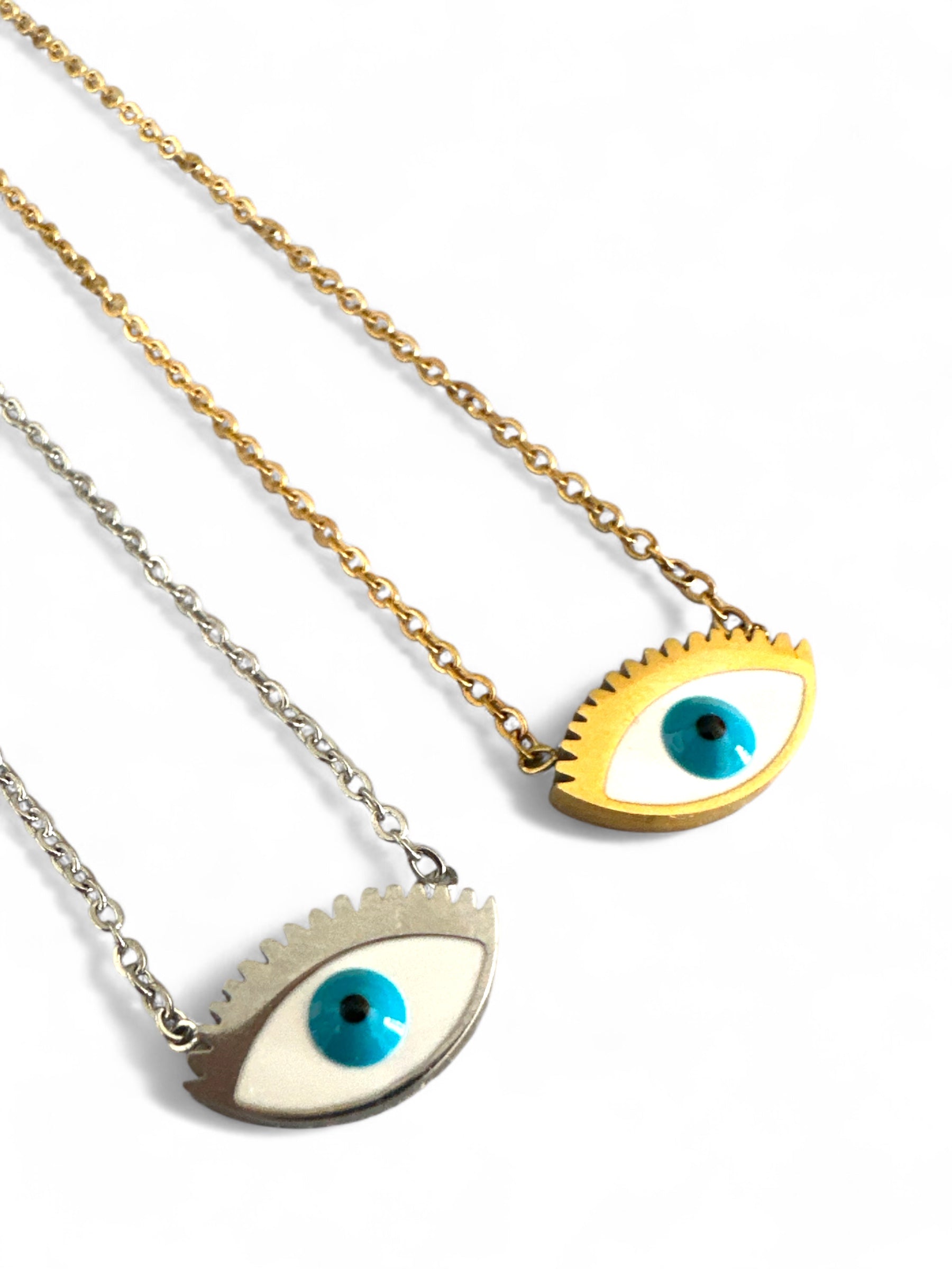 Two necklaces with eye-shaped pendants on a white background