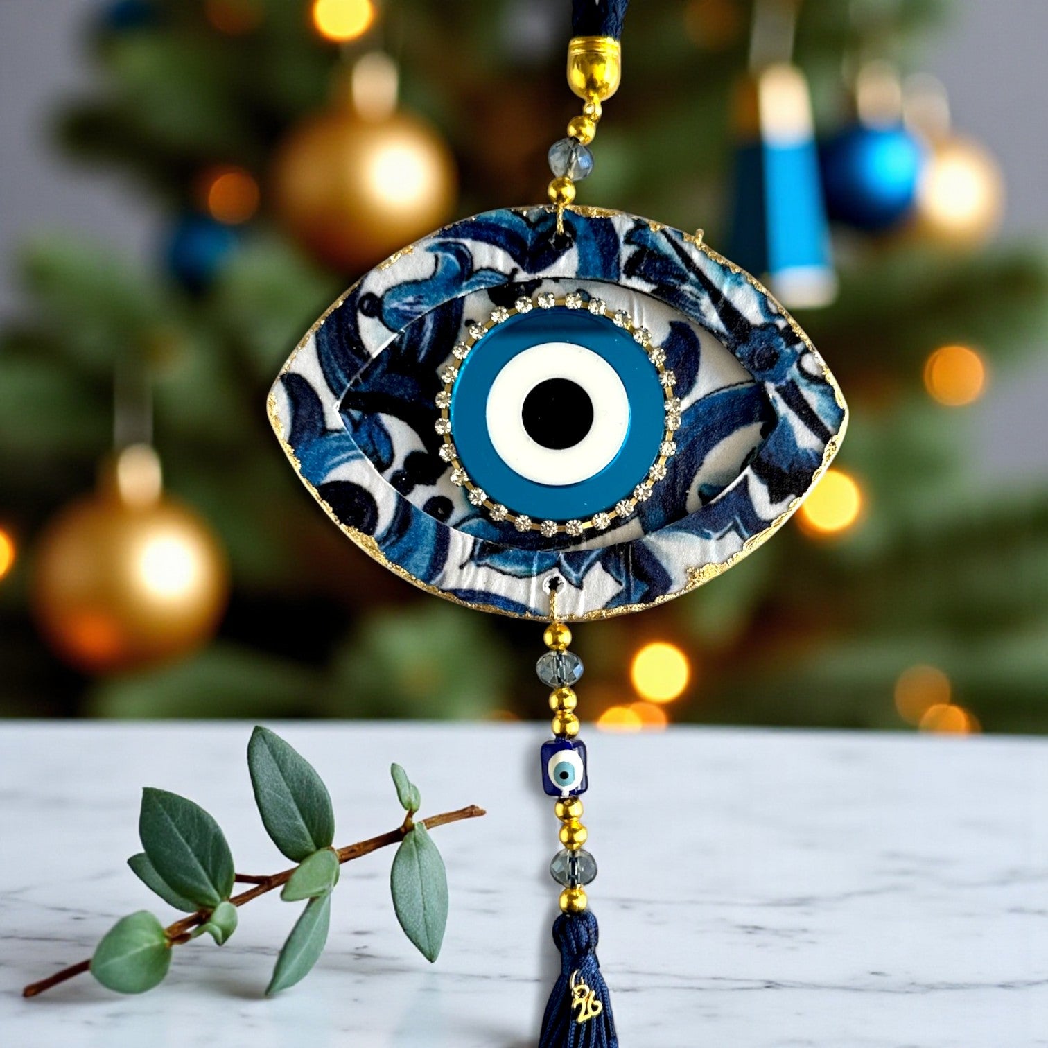 Γούρι 2026 κρεμαστό μάτι με στρας, χάντρες & φούντα – Greek Wishes Χονδρική So Cute by Dimi