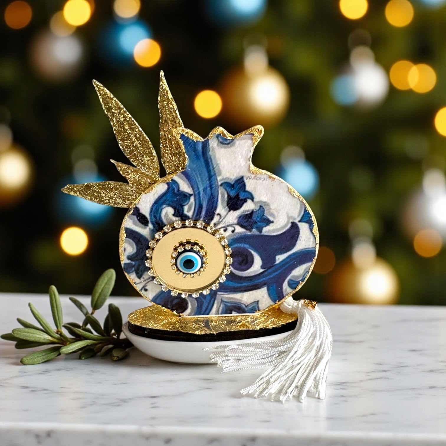 Γούρι 2026 ρόδι με χρυσά φύλλα ελιάς & μάτι – Greek Wishes Χονδρική So Cute by Dimi