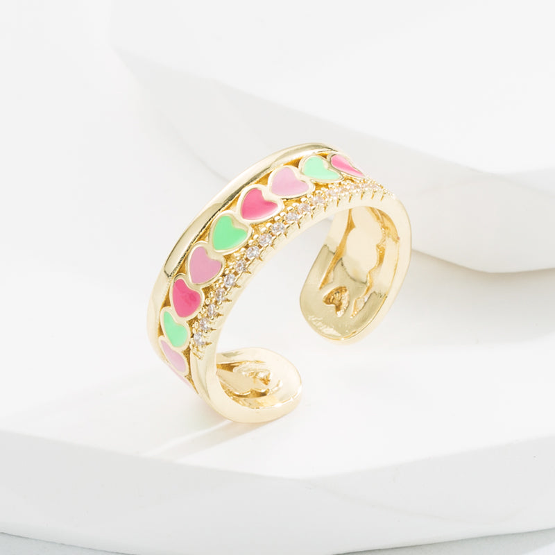 Ring with hearts and zircon