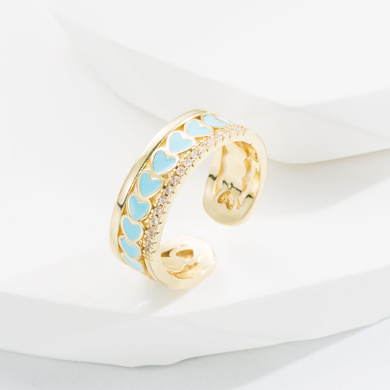 Ring with hearts and zircon