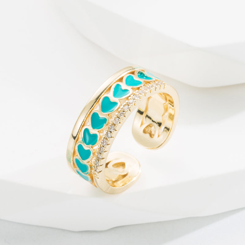 Ring with hearts and zircon
