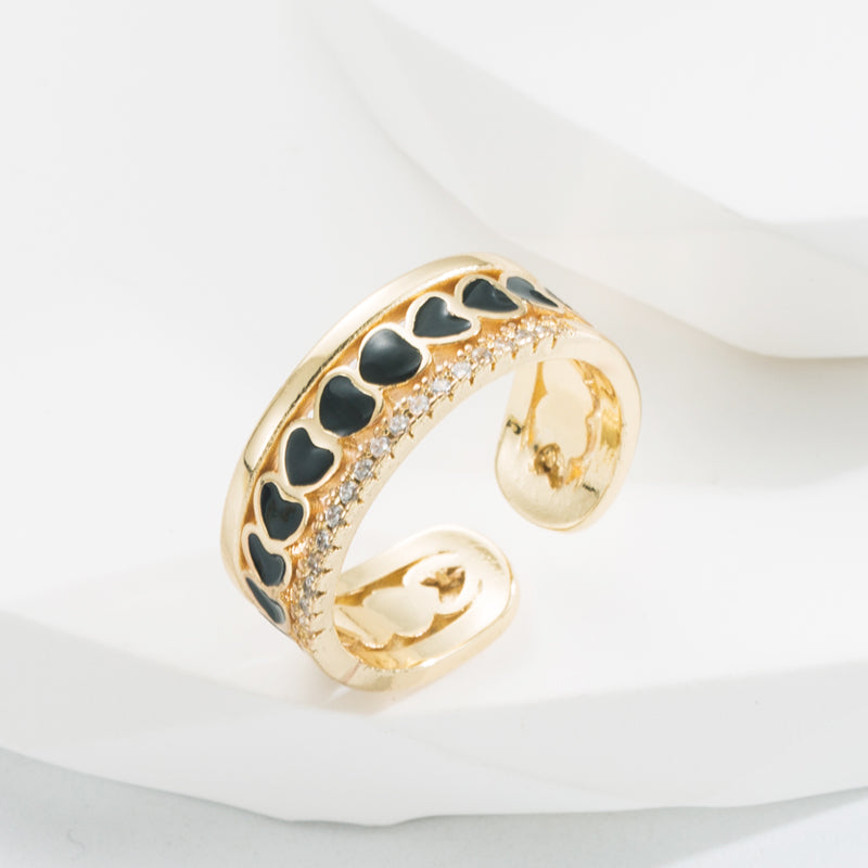 Ring with hearts and zircon