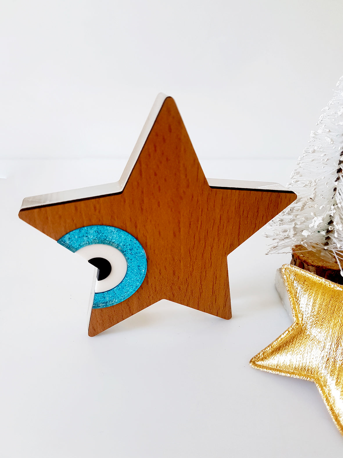 Star shaped table charm of wood with evil eye - SoCuteb2b