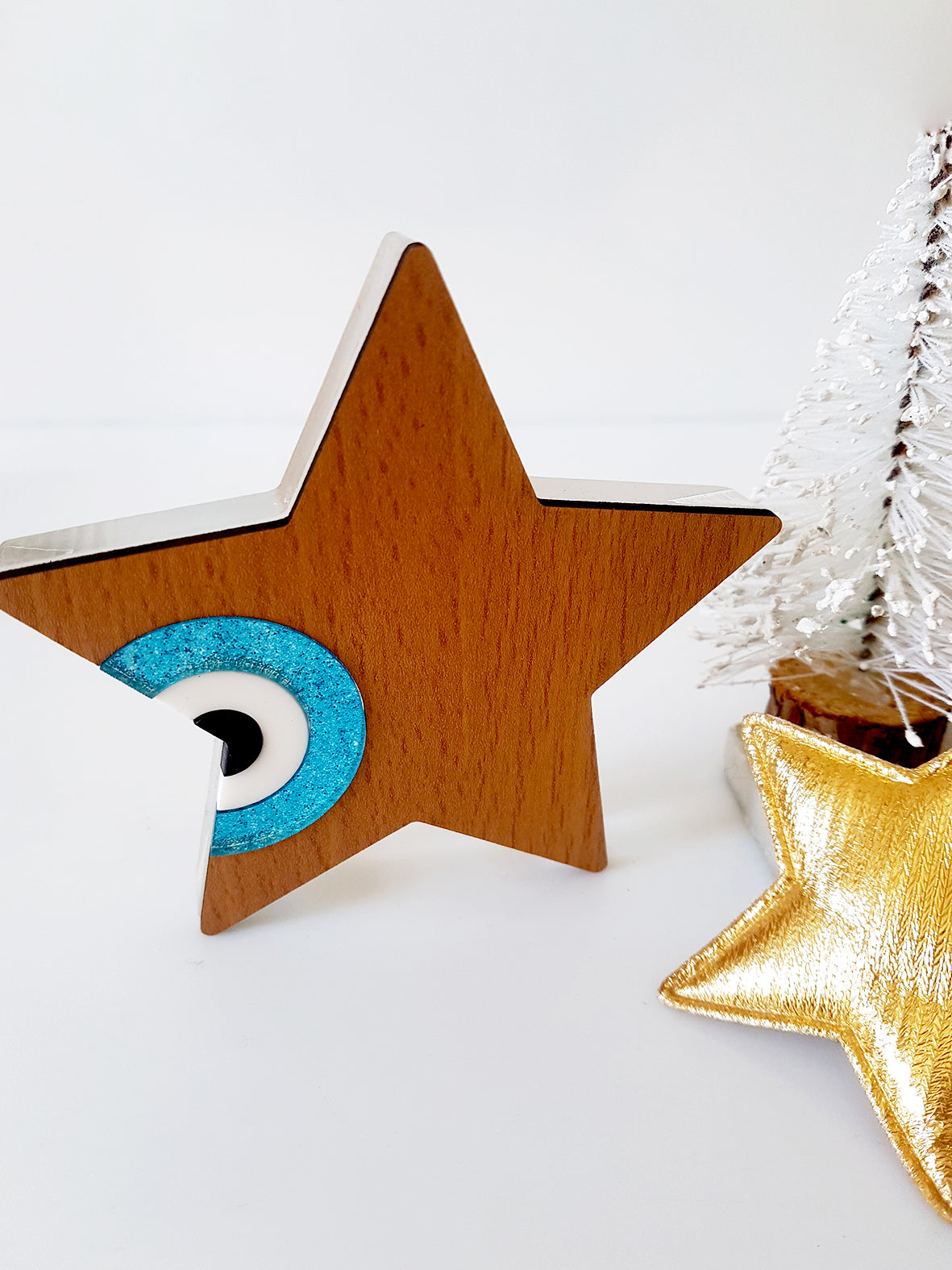 Star shaped table charm of wood with evil eye - SoCuteb2b