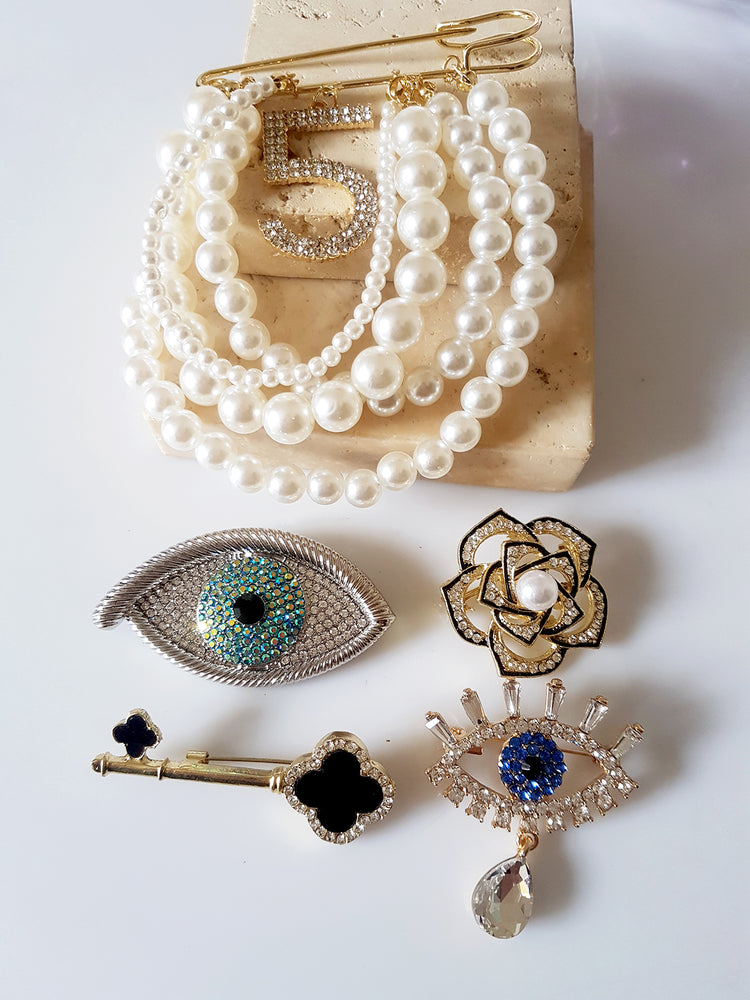 BROOCHES