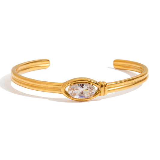 Crystal Glow – Ατσάλινο cuff βραχιόλι σε χρυσό με μακρόστενο ζιργκόν | So Cute By Dimi