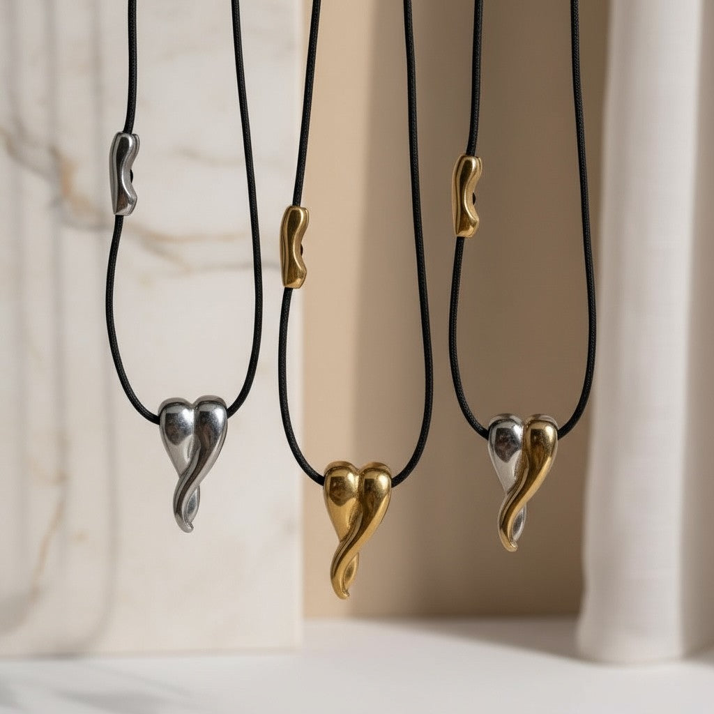 Κολιέ Melted Heart από ατσάλι σε χρυσό, ασημί και δίχρωμο με μαύρο κορδόνι, χονδρική So Cute by Dimi