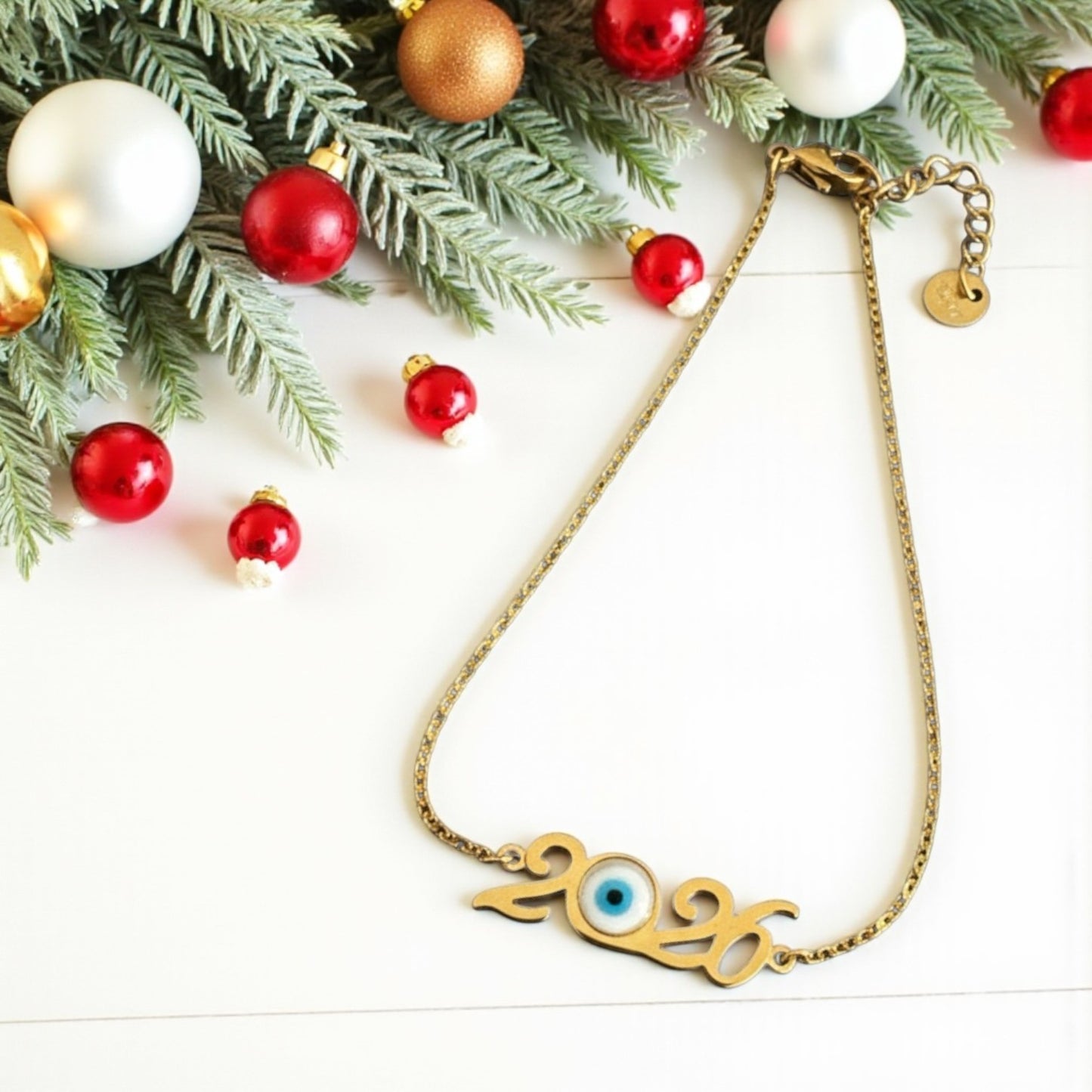 Ατσάλινο βραχιόλι γούρι 2026 με ματάκι σε χρυσό και ασημί – So Cute Wholesale