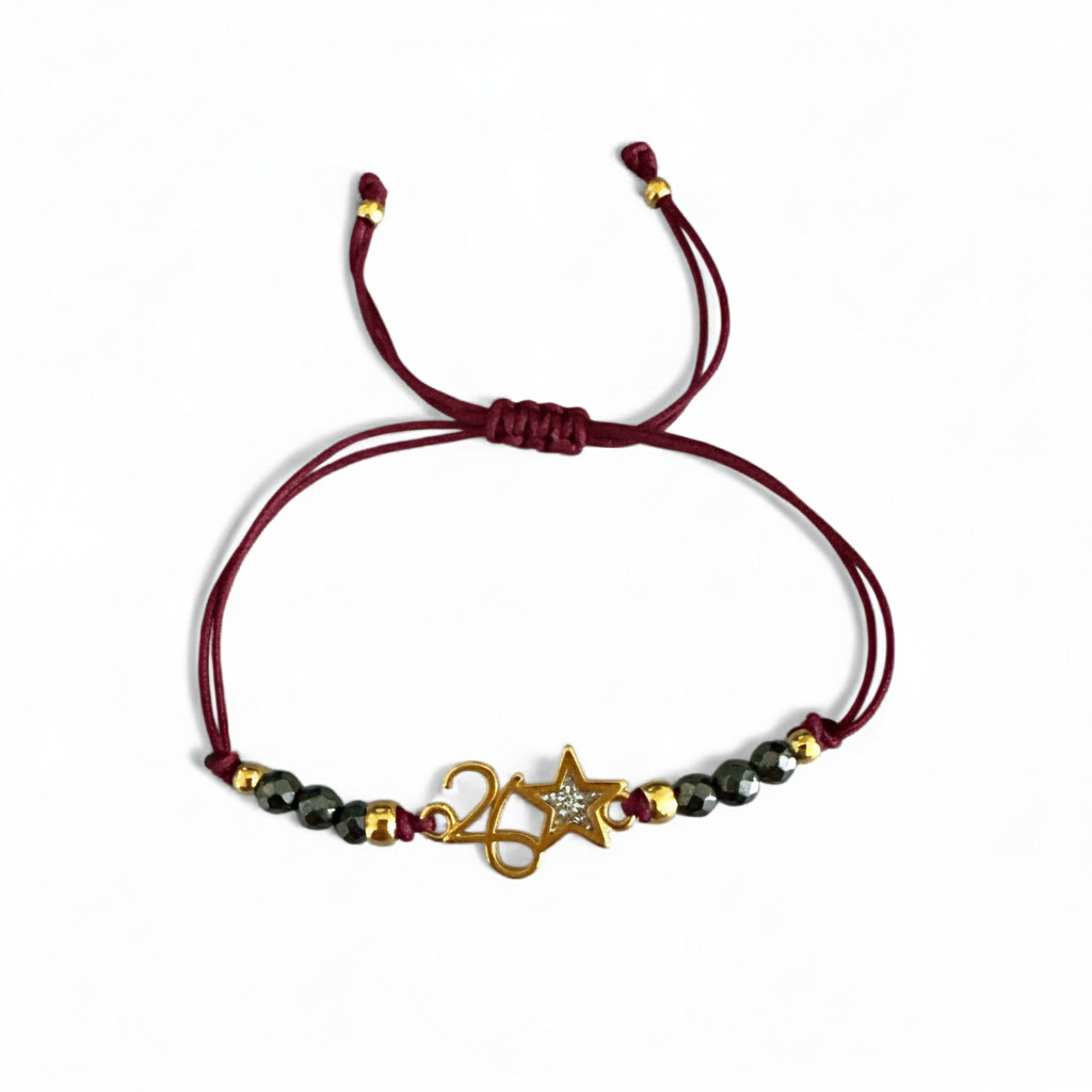 Χειροποίητο βραχιόλι γούρι 2026 με αιματίτη & αστεράκι glitter σε κορδόνι – So Cute by Dimi Wholesale