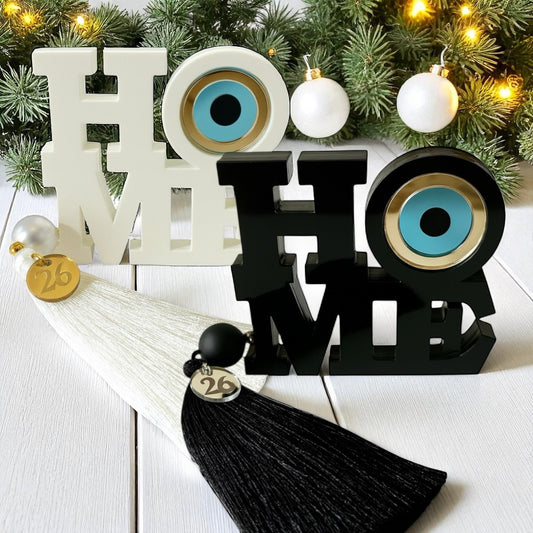 Χειροποίητο γούρι HOME με μάτι, πέρλα και φούντα – So Cute by Dimi Wholesale