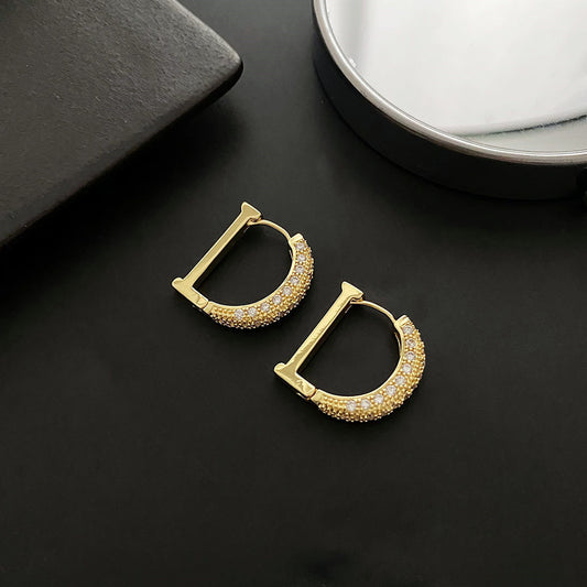 Σκουλαρίκια σε σχήμα D διακοσμημένα με ζιργκόν από χαλκό 