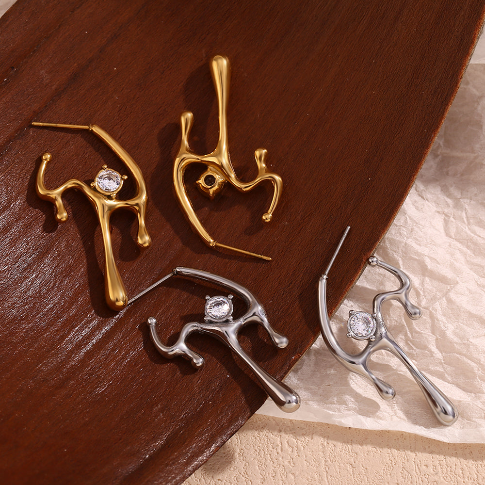 Υπέροχα ακανόνιστα σκουλαρίκια σε μοτίφ υλικού που λιώνει με ζιργκόν από ατσάλι 