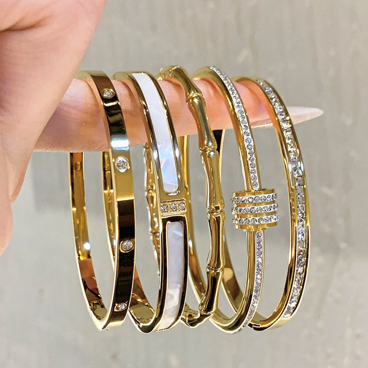 Elegant bangle βραχιόλια με ζιργκόν και κοχύλι σε διάφορα μοτίφ από επιχρυσωμένο ατσάλι τιτανίου