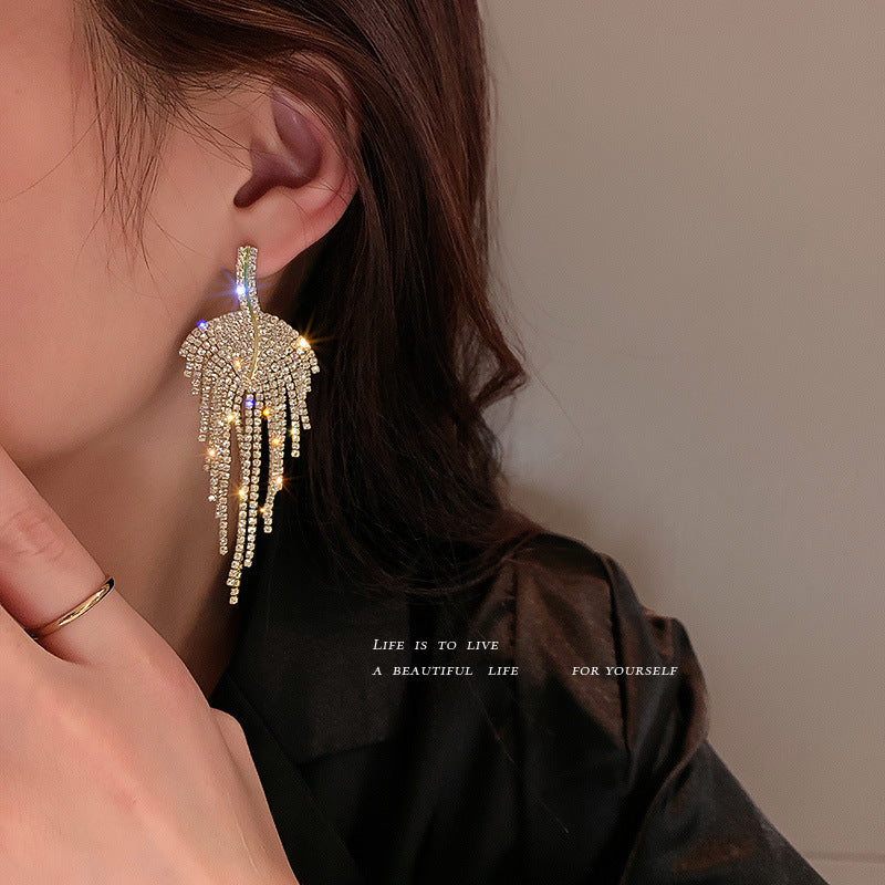 Dangling curved rhinestone earrings