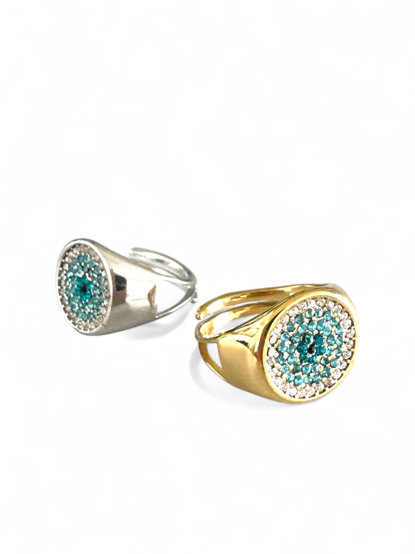 Ατσάλινα δαχτυλίδια So Cute By Dimi σε χρυσό και ασημί με κυκλικό σχέδιο και ζιργκόν σε τιρκουάζ και διάφανο χρώμα.