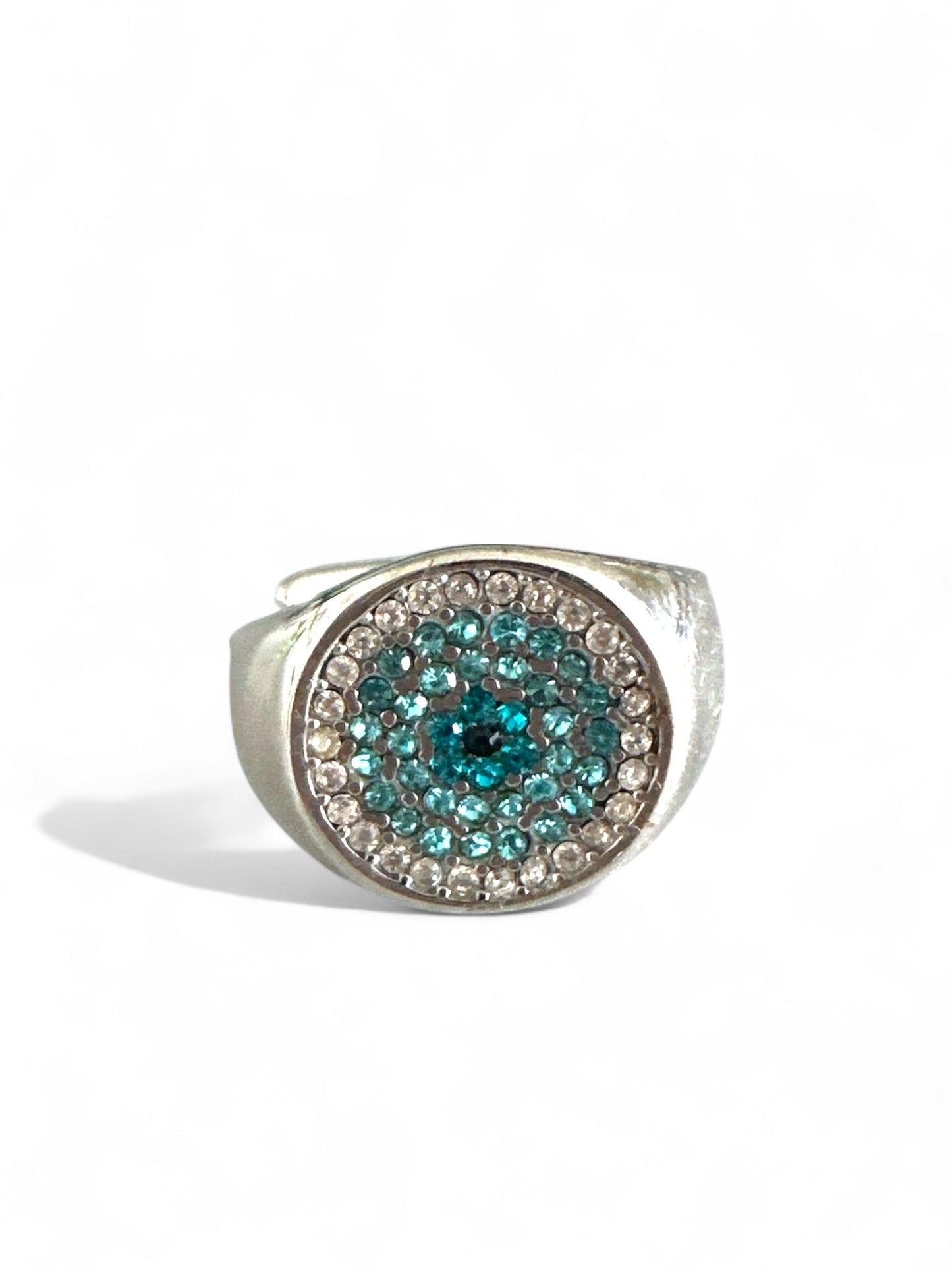 Silver ring with blue gemstones on a white background