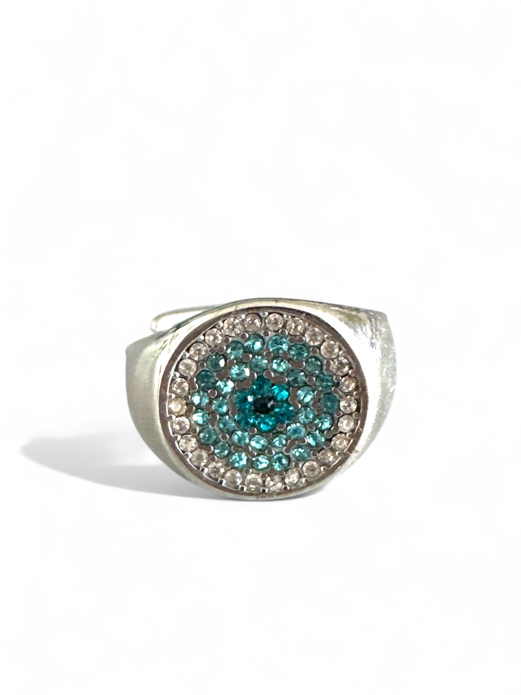 Silver ring with blue gemstones on a white background