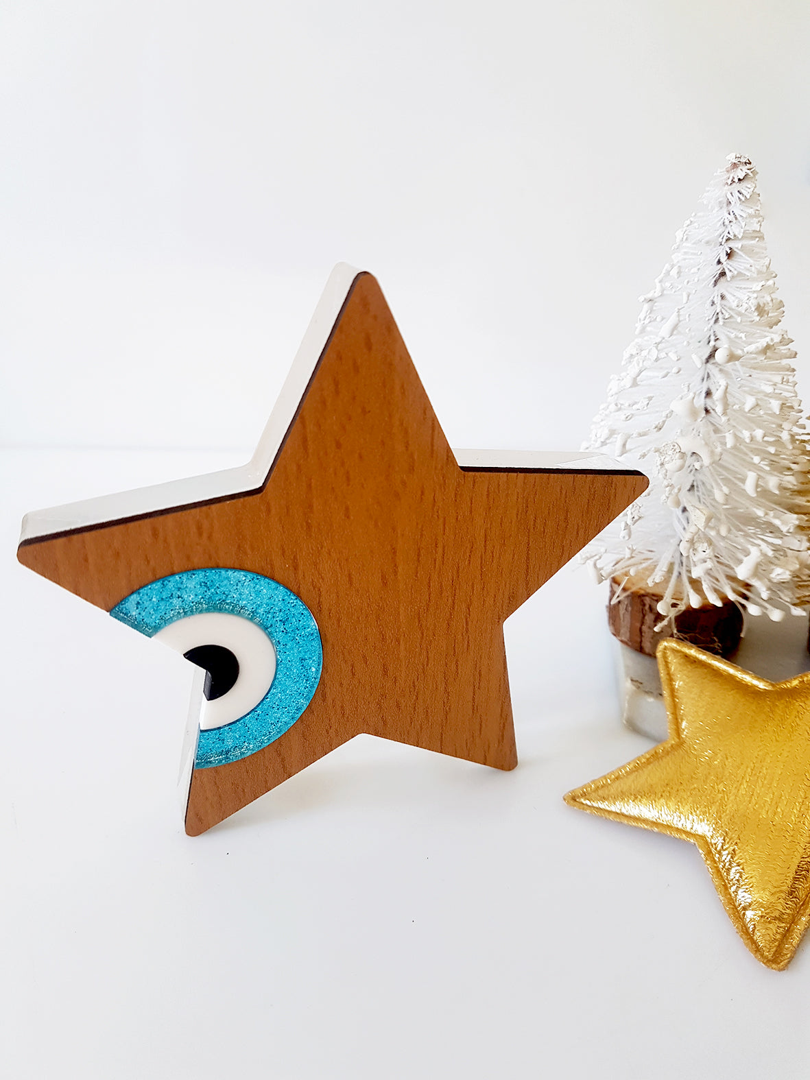 Star shaped table charm of wood with evil eye - SoCuteb2b